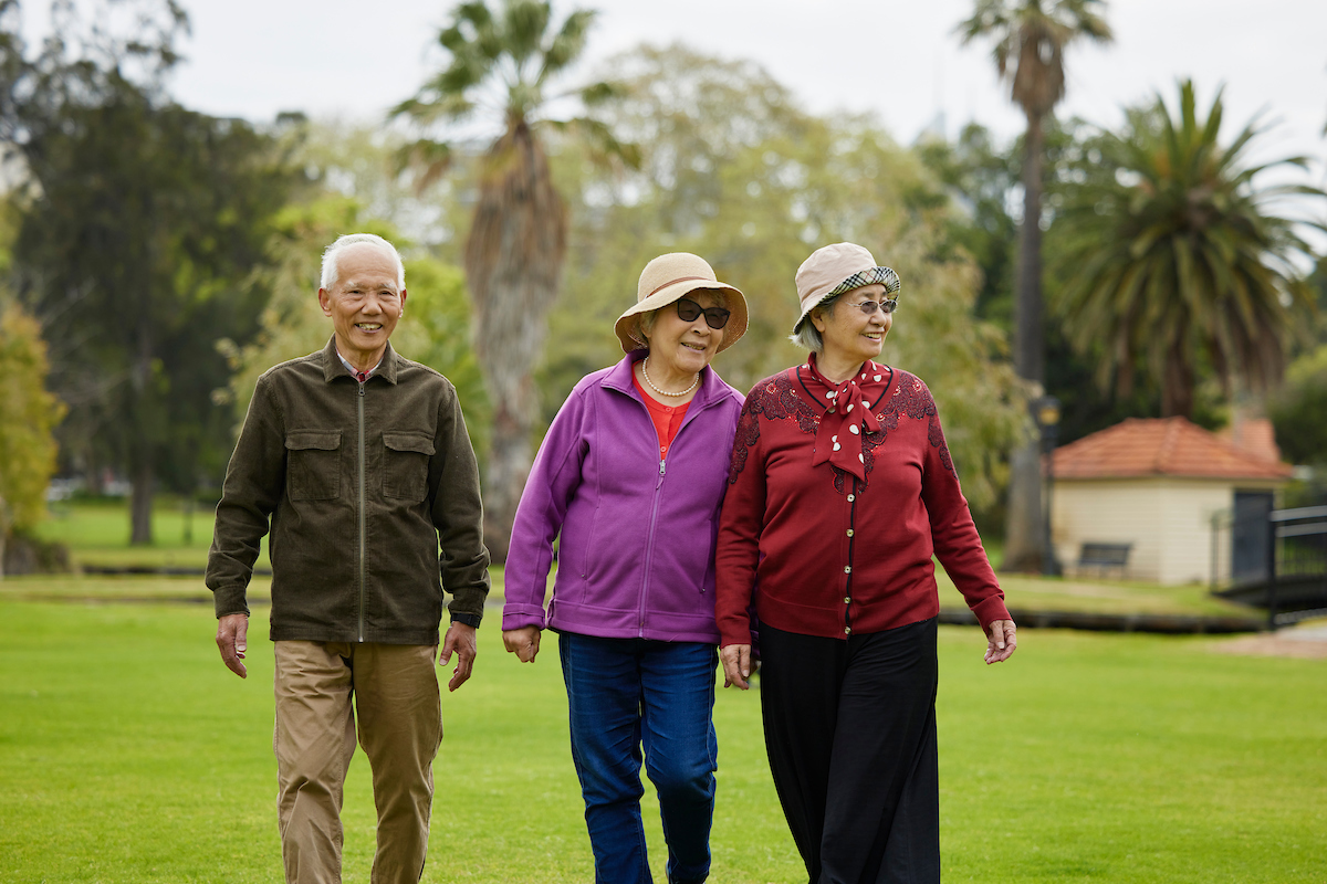 Seniors walking in park