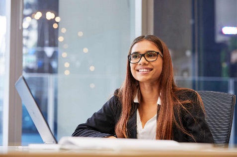 A woman sitting at a computer