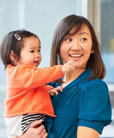 About OMI picture A women holding an infant.