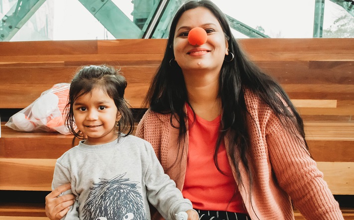 Mother and daughter with red nose