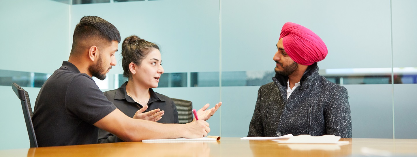 Interpreter, CaLD client and professional officer in a meeting